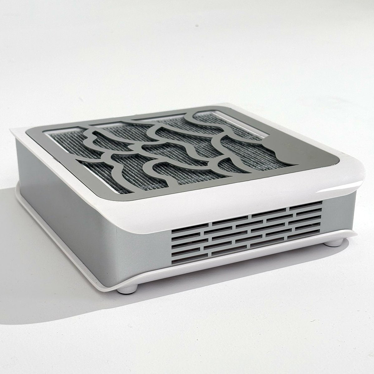 Widok z tyłu na pochłaniacz pyłu Holivica Pro 2, pokazujący kratkę wylotu powietrza i zaokrągloną obudowę.